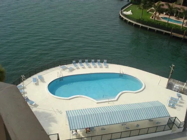 a balcony with table and chairs