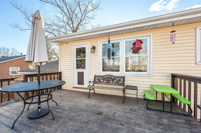 a balcony with furniture and wooden floor