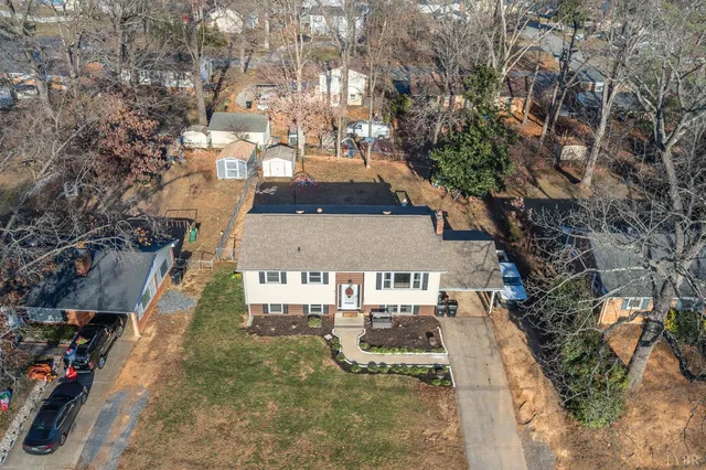 an aerial view of residential houses with outdoor space