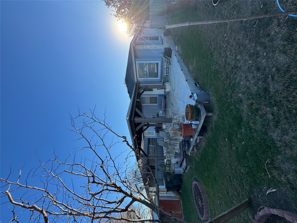 15200 Mandarin Crossing Pflugerville, TX 78660 - Photo 3 of 17 a front view of a house with a garden and patio