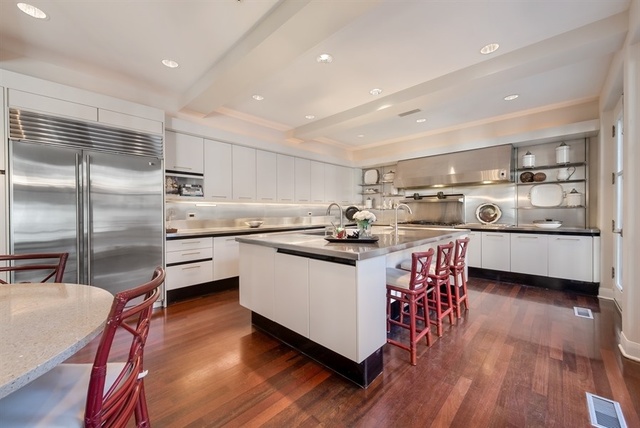 1939 North Howe Street Chicago, IL 60614 - Photo 13 of 54 a kitchen with stainless steel appliances a sink a stove a refrigerator cabinets and wooden floor