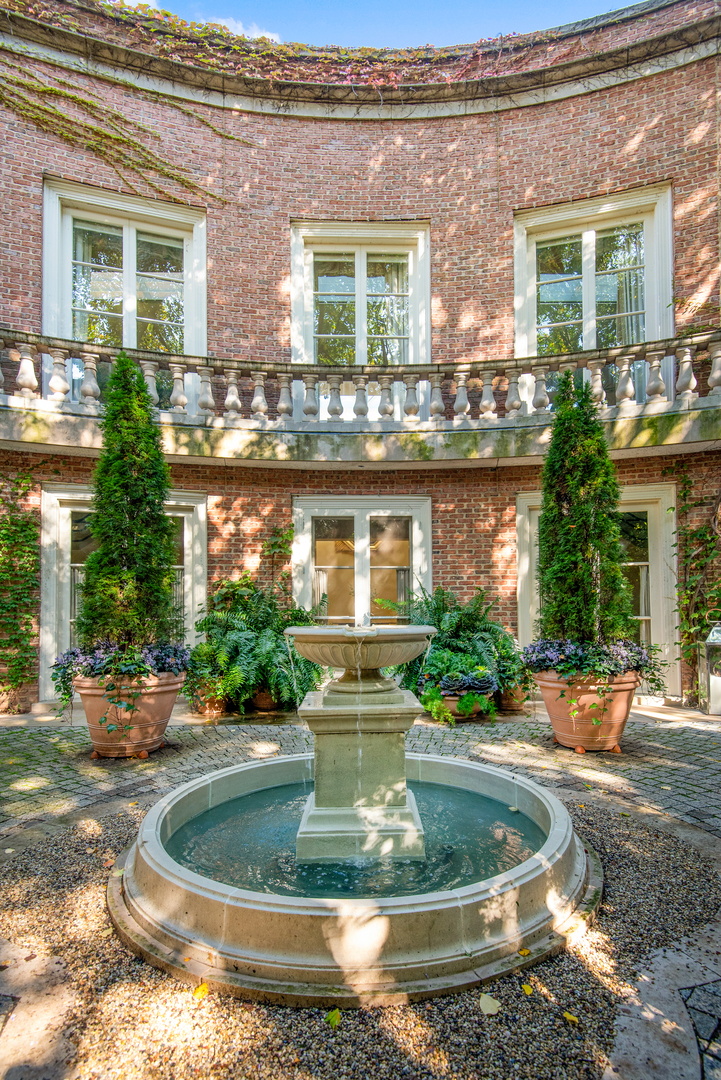 1939 North Howe Street Chicago, IL 60614 - Photo 24 of 54 a view of a house with a yard and sitting space