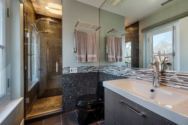 1939 North Howe Street Chicago, IL 60614 - Photo 32 of 54 a bathroom with a sink and a mirror