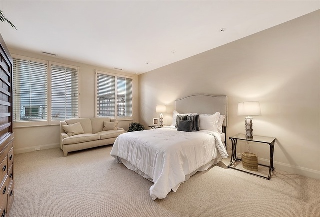 1939 North Howe Street Chicago, IL 60614 - Photo 33 of 54 a bedroom with a bed and a couch with windows