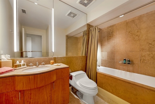 1939 North Howe Street Chicago, IL 60614 - Photo 34 of 54 a bathroom with a sink a toilet and shower