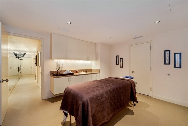 1939 North Howe Street Chicago, IL 60614 - Photo 45 of 54 a spacious bedroom with a bed and a table