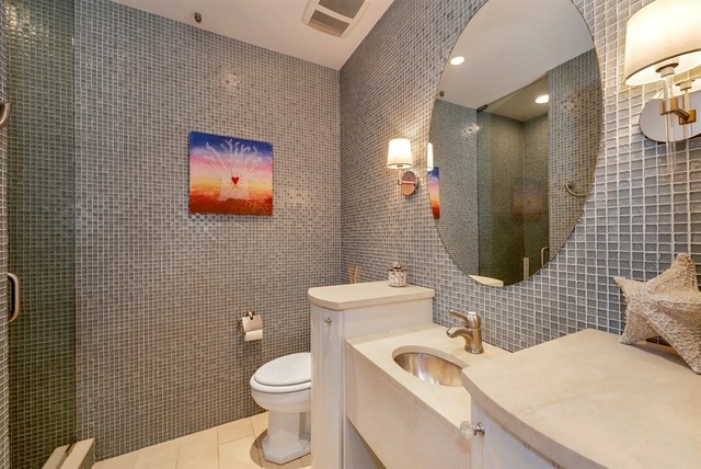 1939 North Howe Street Chicago, IL 60614 - Photo 49 of 54 a bathroom with a sink a toilet and mirror