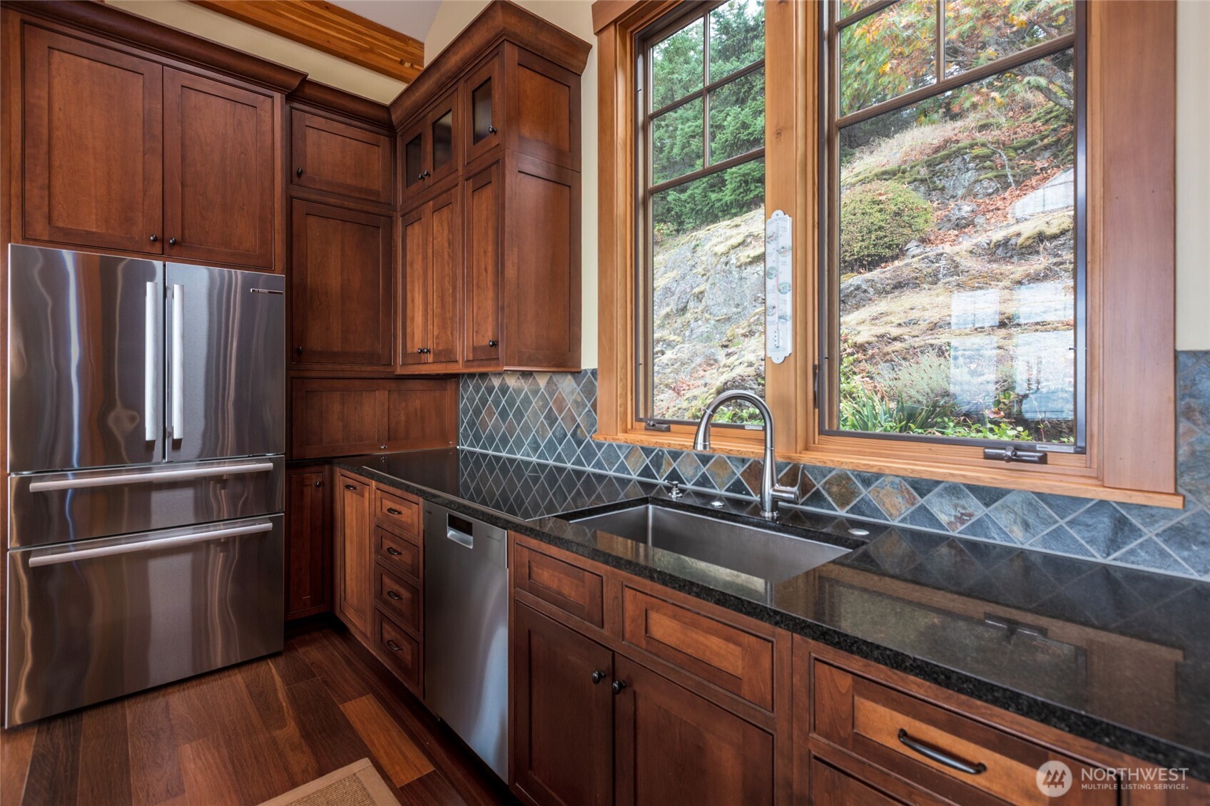 260 West Side Road Friday Harbor, WA 98250 - Photo 11 of 40 a kitchen with granite countertop a refrigerator and a sink