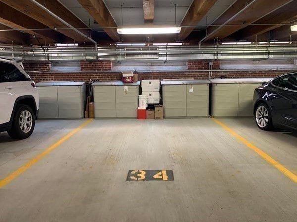 a view of parking garage with cars