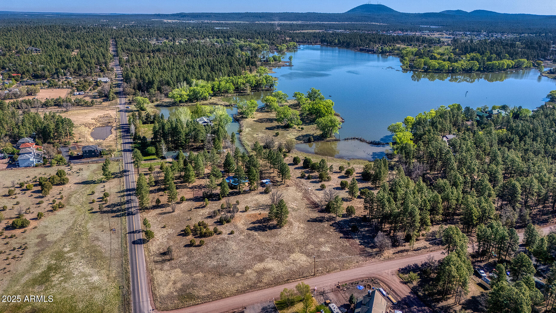 Pinetop-lakeside Larson Road Lakeside, AZ 85929 - Photo 22 of 45 an aerial view of a house with a lake view