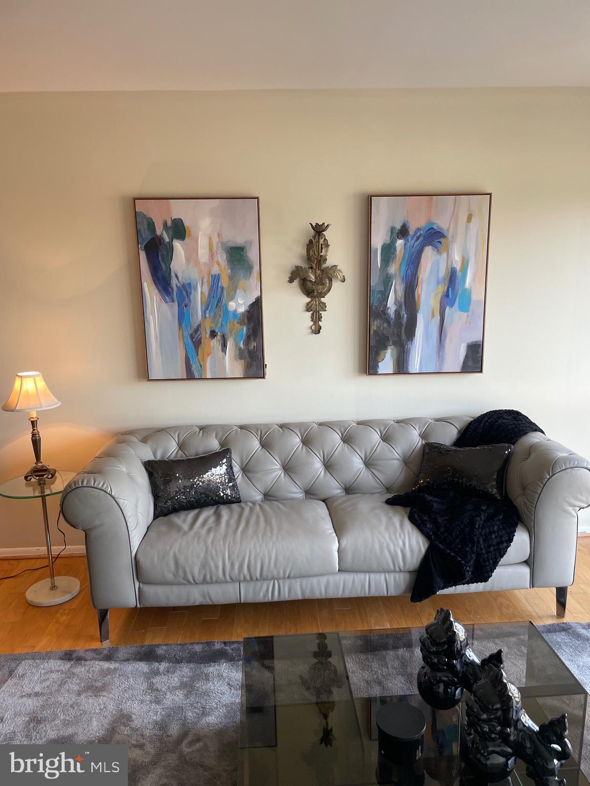 7600 Roosevelt Boulevard, Unit 806 Philadelphia, PA 19152 - Photo 13 of 16 a living room with furniture and a painting on the wall
