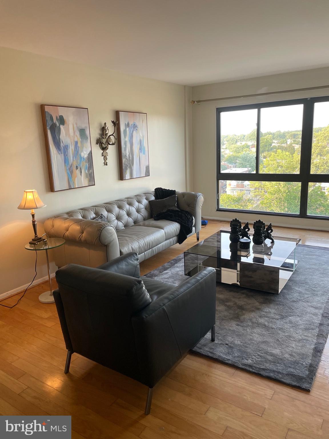 7600 Roosevelt Boulevard, Unit 806 Philadelphia, PA 19152 - Photo 14 of 16 a living room with furniture and a large window