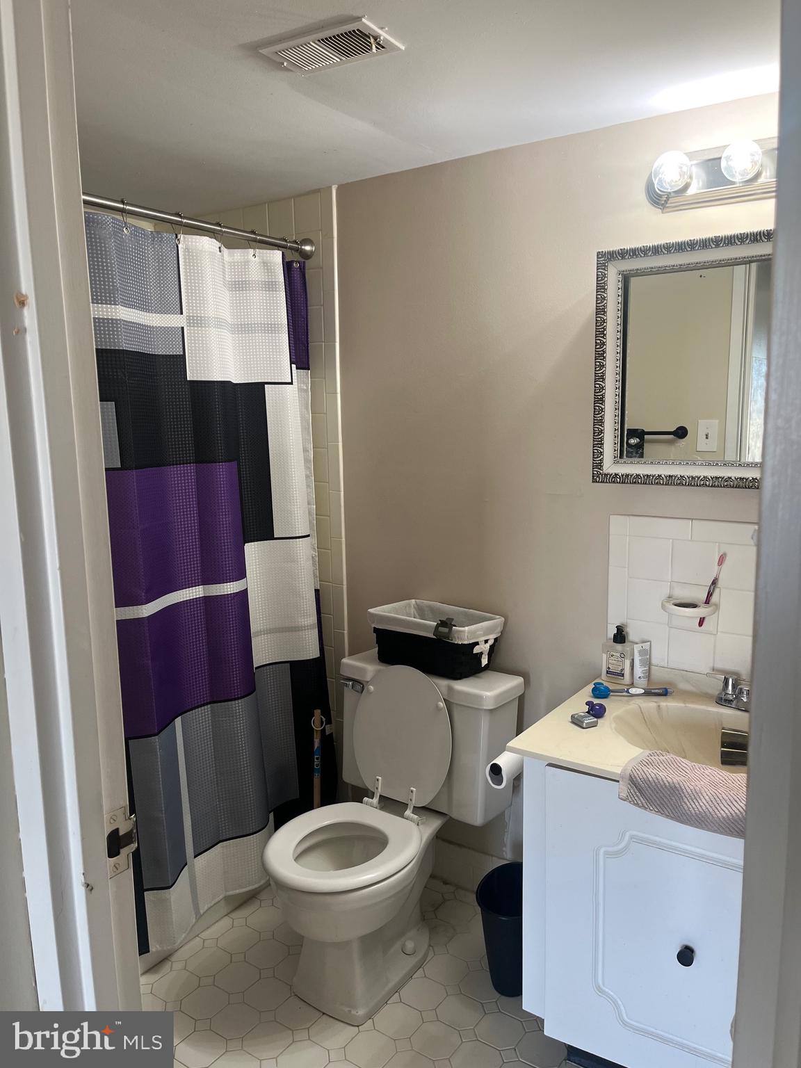 7600 Roosevelt Boulevard, Unit 806 Philadelphia, PA 19152 - Photo 16 of 16 a white toilet sitting next to a bathroom sink