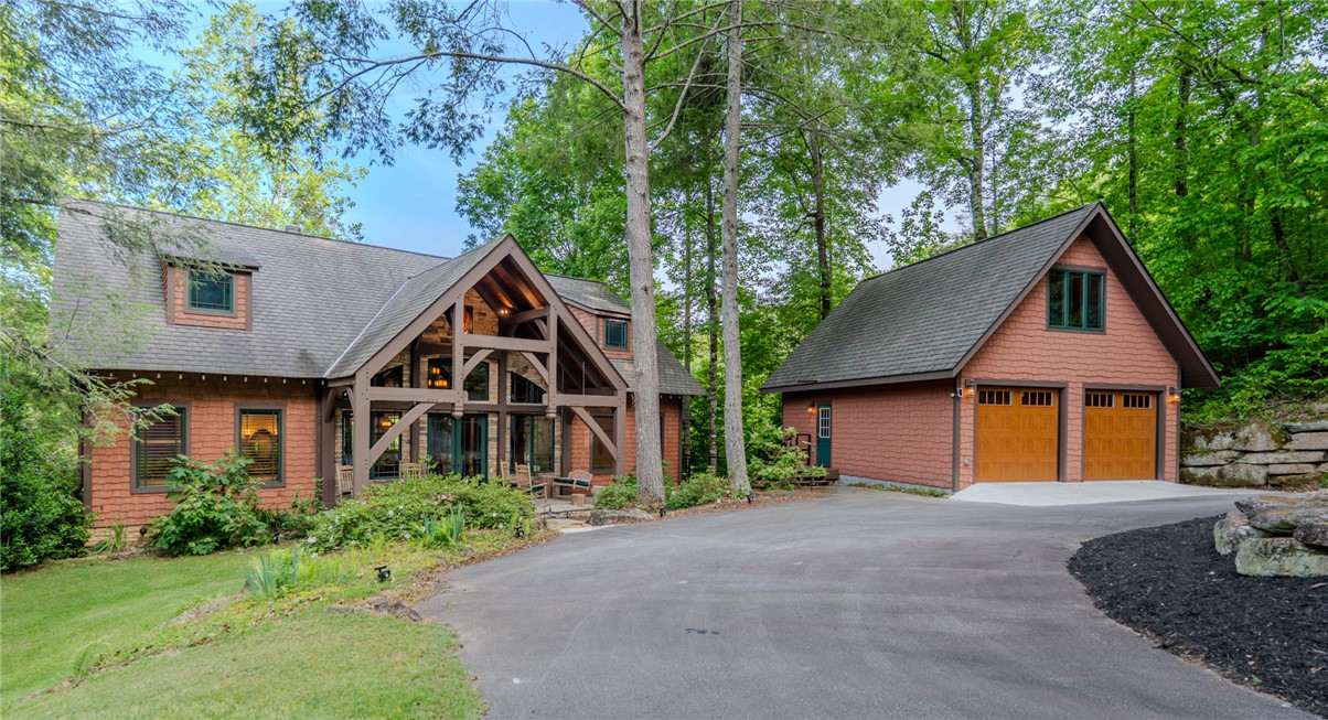 102 State Rd S-39-143 Sunset, SC 29685 - Photo 39 of 47 This captivating home boasts a harmonious blend of architectural styles, nestled among mature trees.