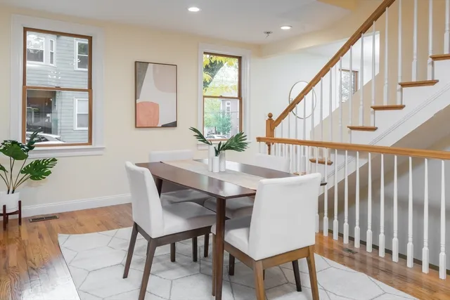a view of a livingroom with furniture window and wooden floor
