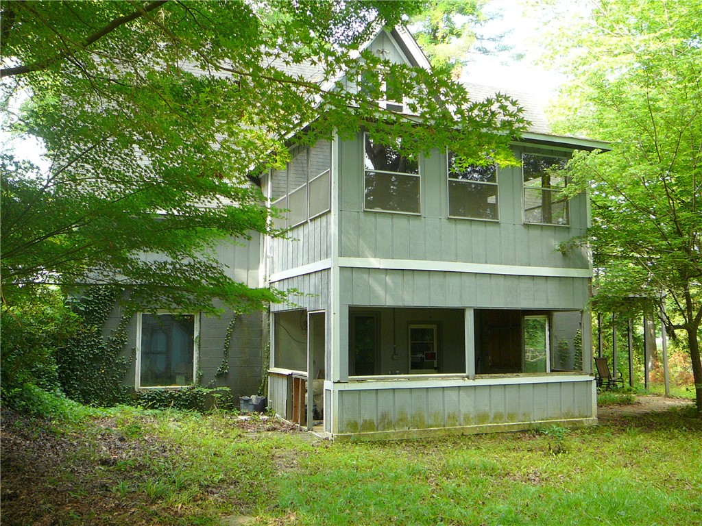 117 C-14-70 Anderson, SC 29621 - Photo 6 of 7 A private wooded setting surrounds this charming multi-story residence, offering peaceful seclusion.