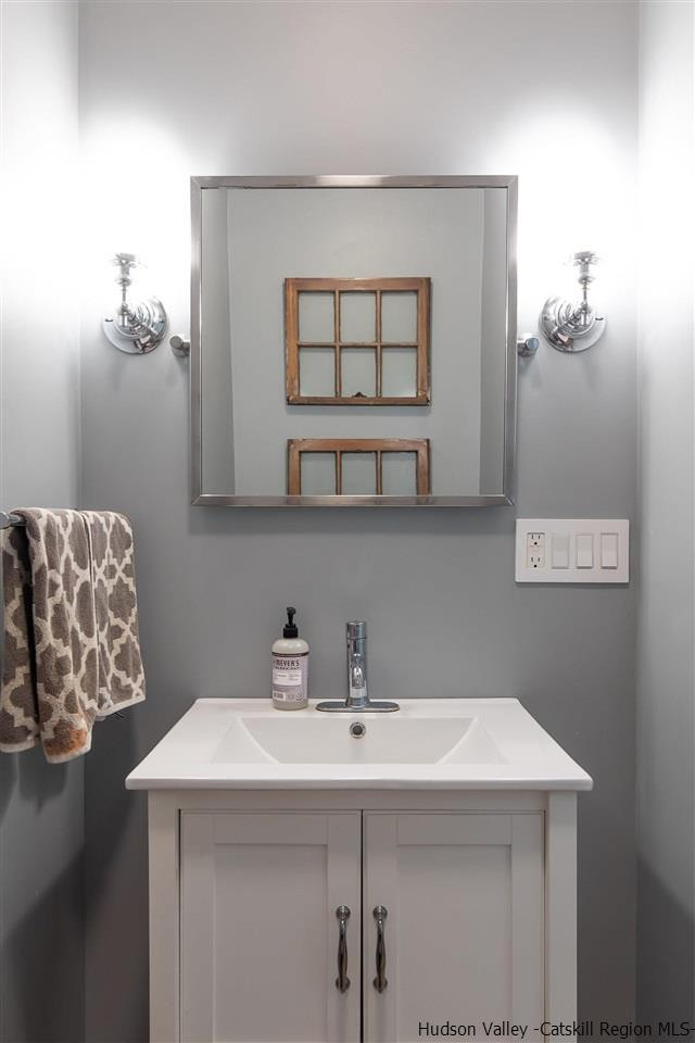 128 Bakertown Road Accord, NY 12404 - Photo 14 of 23 a bathroom with a sink and a mirror