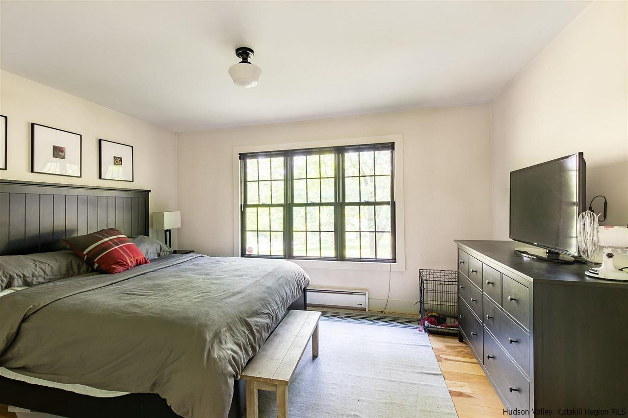 128 Bakertown Road Accord, NY 12404 - Photo 15 of 23 a bedroom with a bed and a flat screen tv