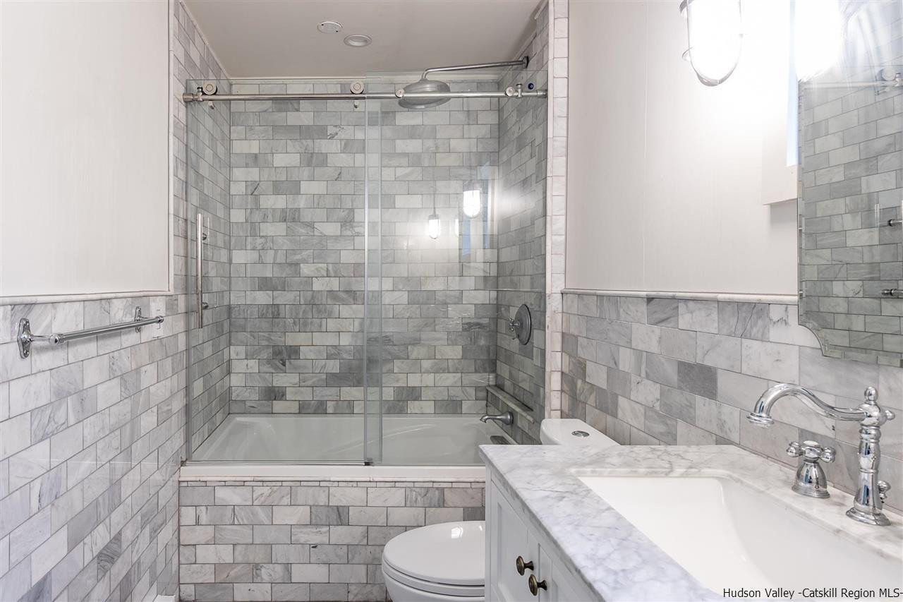 128 Bakertown Road Accord, NY 12404 - Photo 17 of 23 a bathroom with a granite countertop bathtub shower sink and toilet