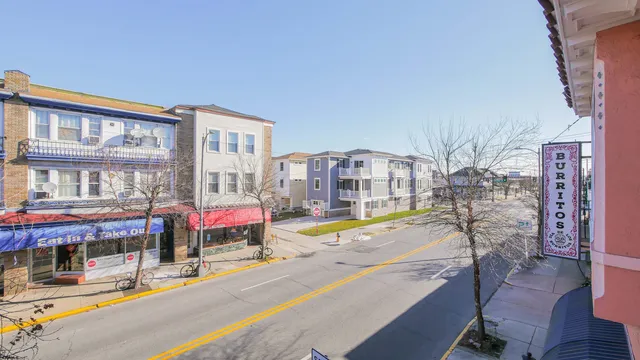 a view of a building with a yard