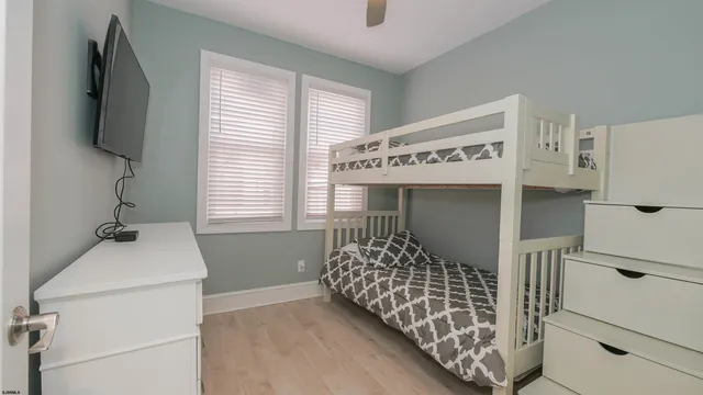 a bedroom with a bed and cabinets