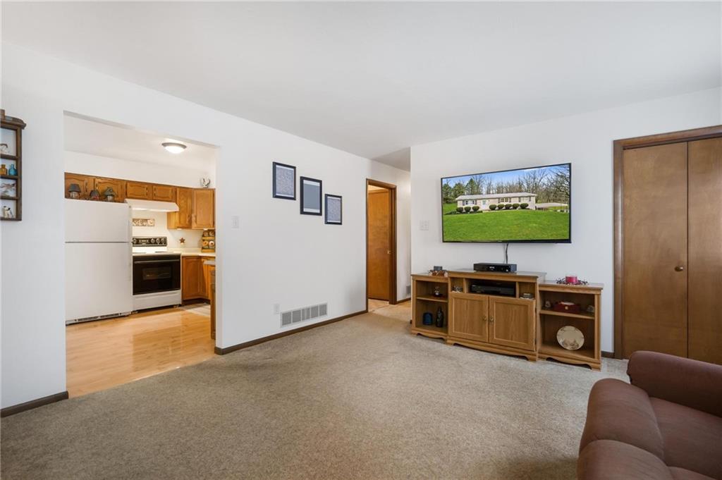 205 Ross Road Eighty Four, PA 15330 - Photo 5 of 25 a living room with furniture and a flat screen tv