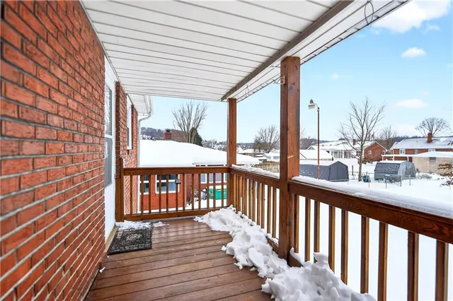 a view of a balcony with wooden floor