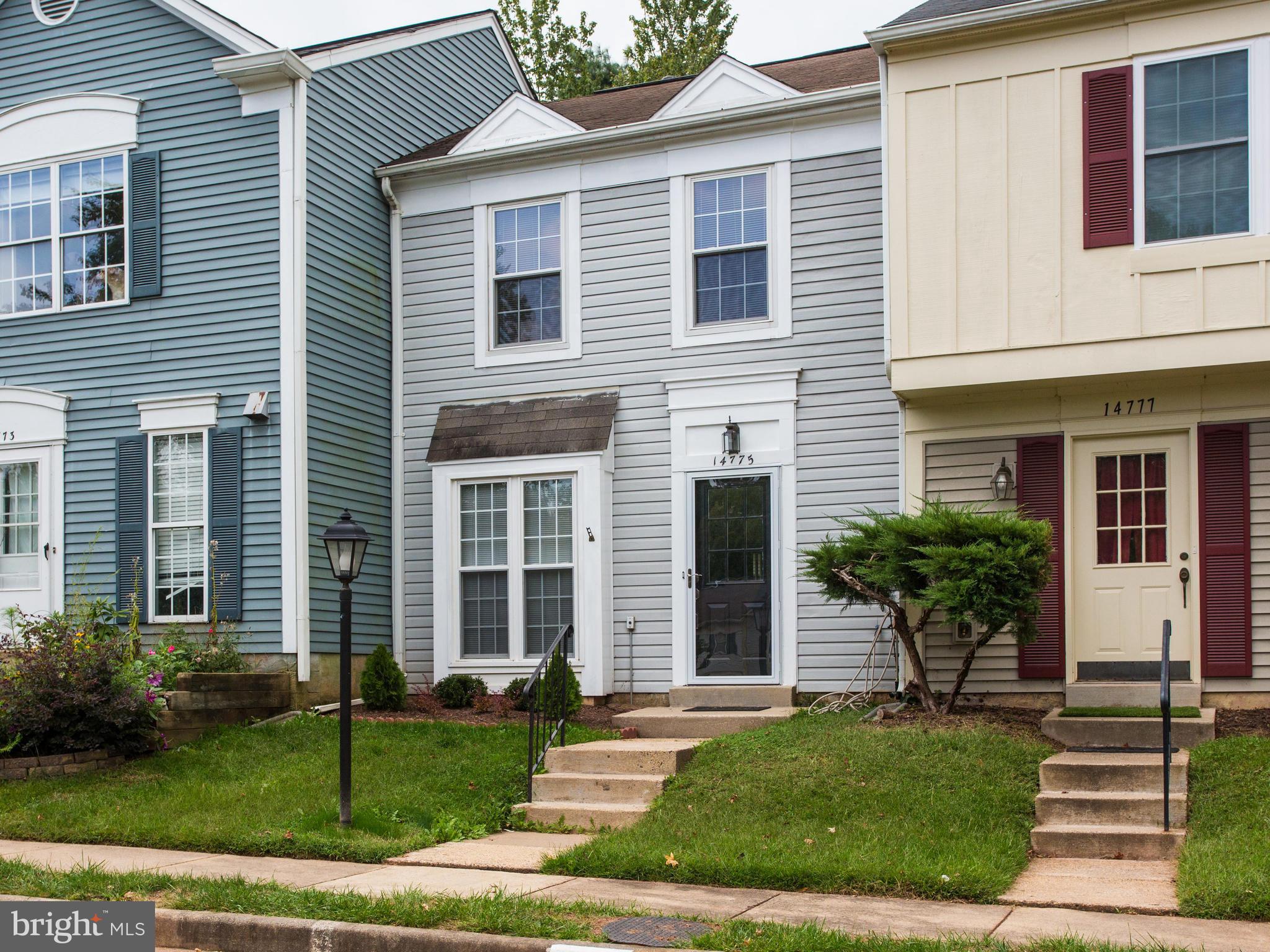 14775 Basingstoke Loop Centreville, VA 20120 - Photo 2 of 21 a front view of a house with garden