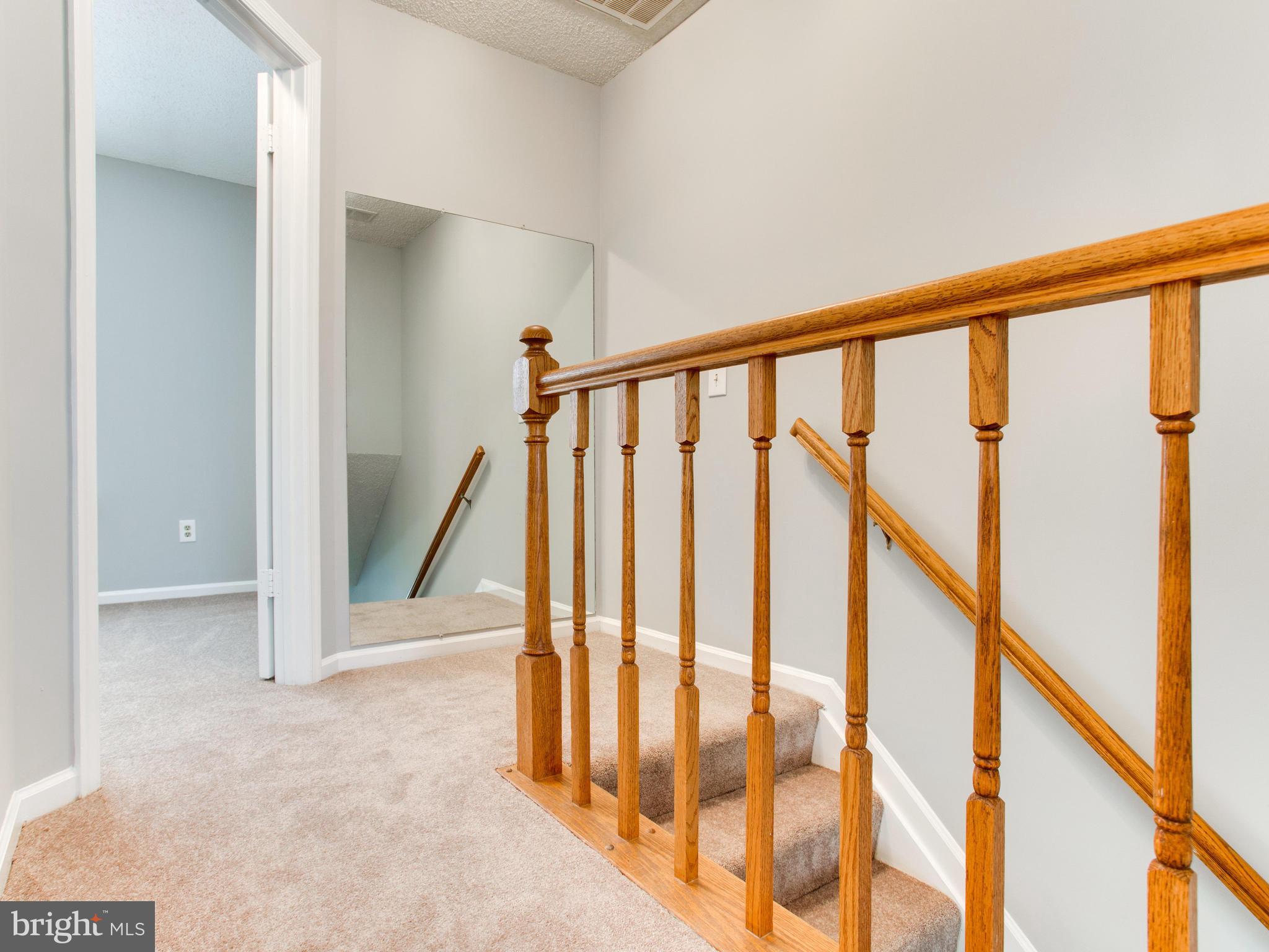 14775 Basingstoke Loop Centreville, VA 20120 - Photo 13 of 21 a view of staircase with railing and stairs