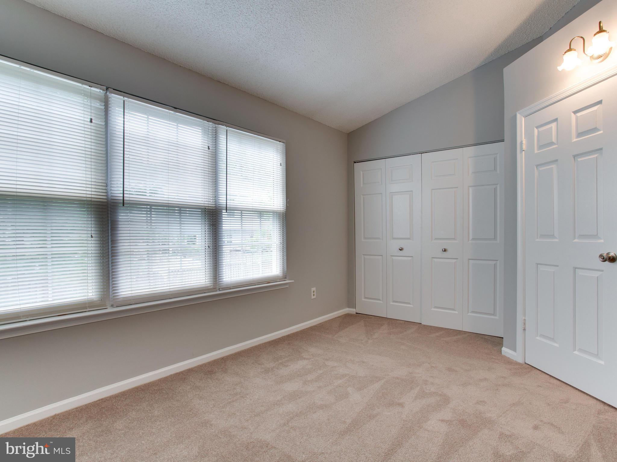 14775 Basingstoke Loop Centreville, VA 20120 - Photo 15 of 21 a view of an empty room with a window