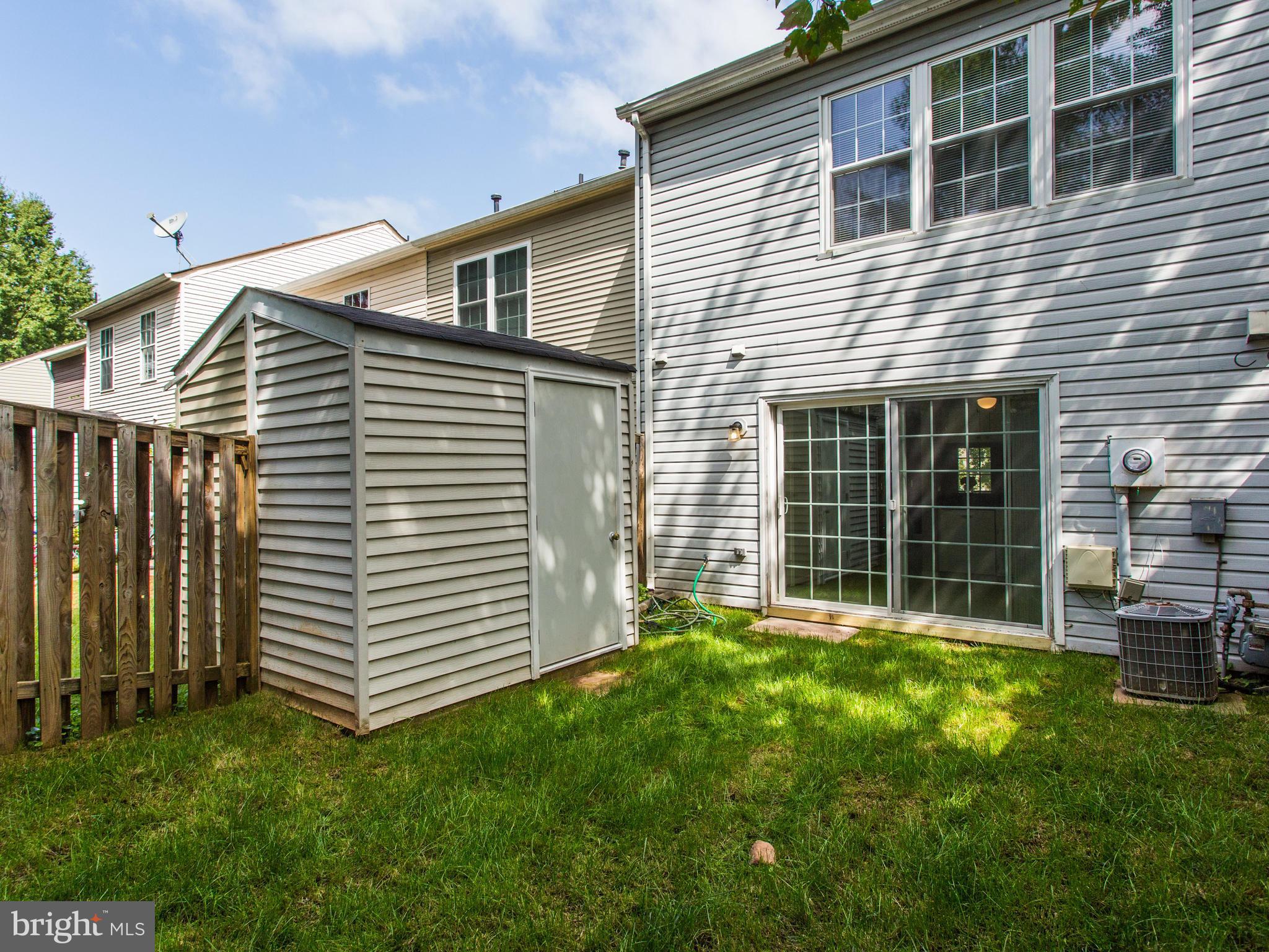 14775 Basingstoke Loop Centreville, VA 20120 - Photo 20 of 21 a front view of a house with a garden
