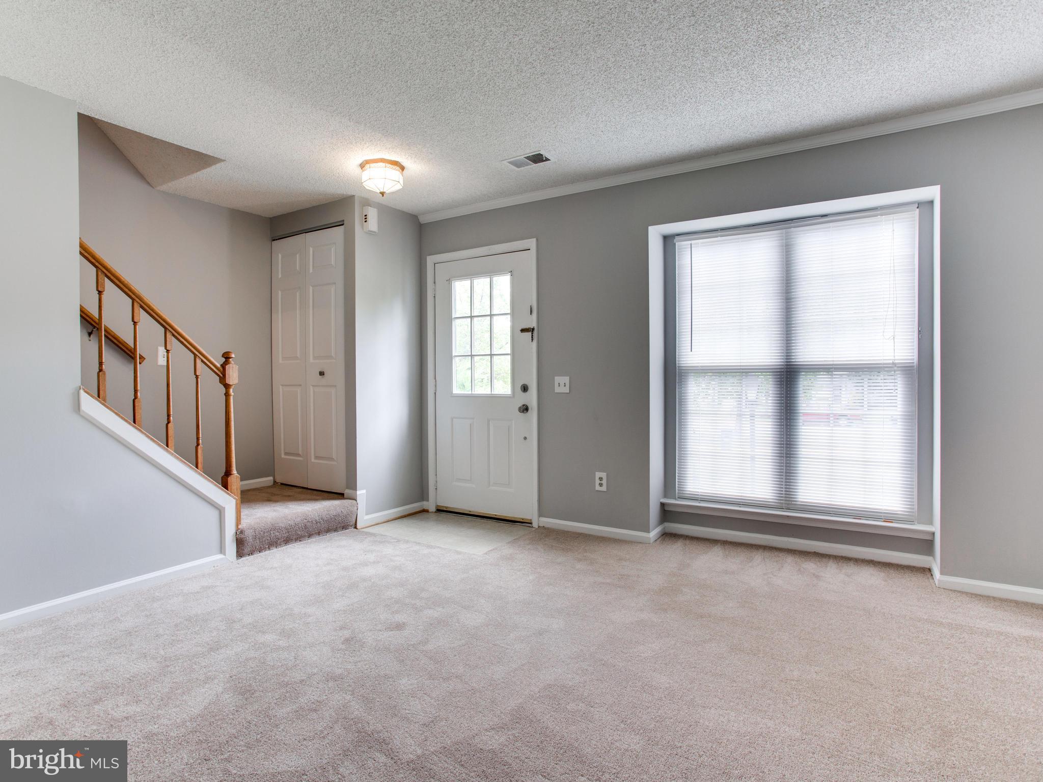 14775 Basingstoke Loop Centreville, VA 20120 - Photo 3 of 21 an empty room with windows and closet