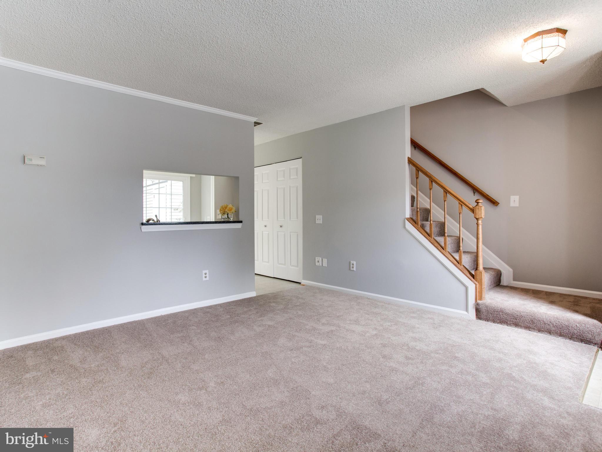 14775 Basingstoke Loop Centreville, VA 20120 - Photo 4 of 21 a view of an empty room with windows