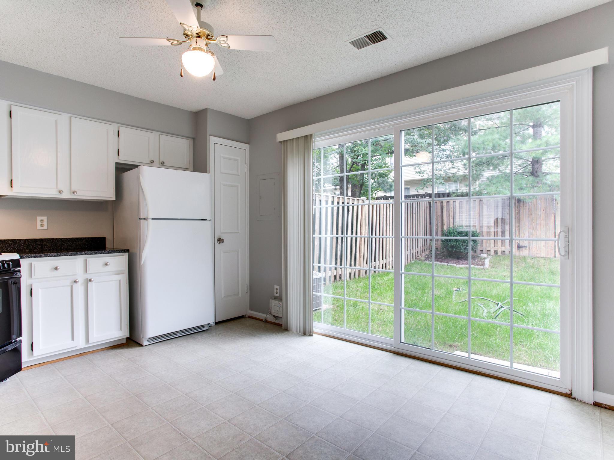 14775 Basingstoke Loop Centreville, VA 20120 - Photo 7 of 21 a view of a kitchen with an empty space and a window