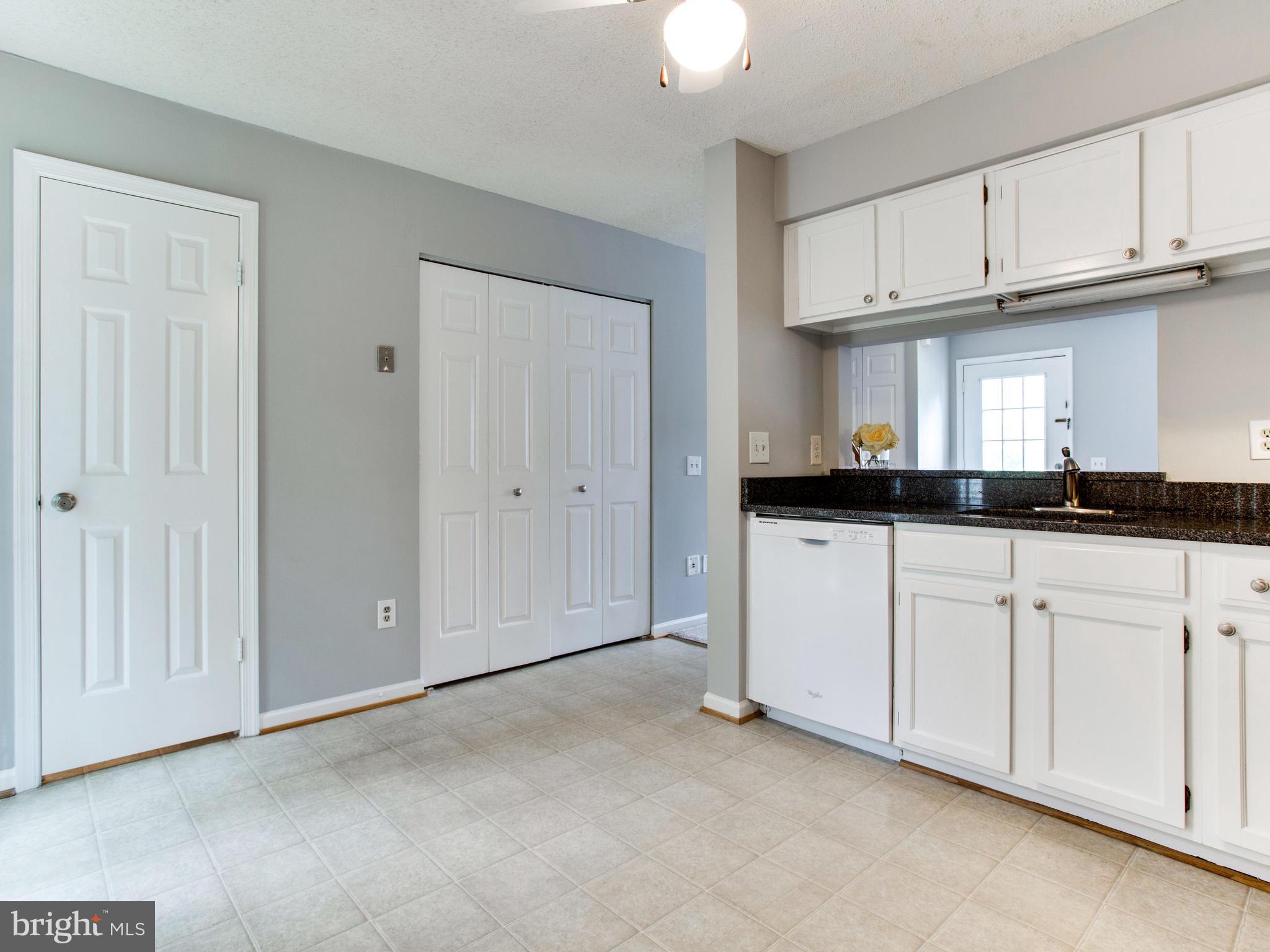 14775 Basingstoke Loop Centreville, VA 20120 - Photo 9 of 21 a view of a kitchen with white cabinets