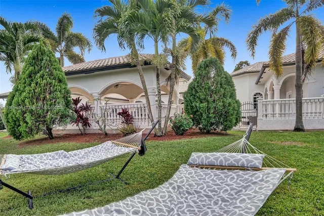 a living room with furniture and white walls