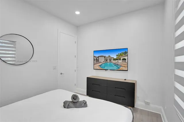 a bedroom with a bed and a lamp