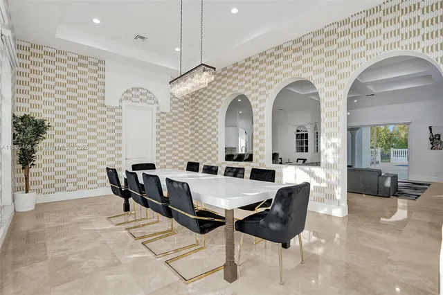 a view of a chairs and table on the deck