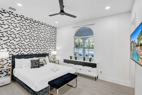 a view of swimming pool with seating area