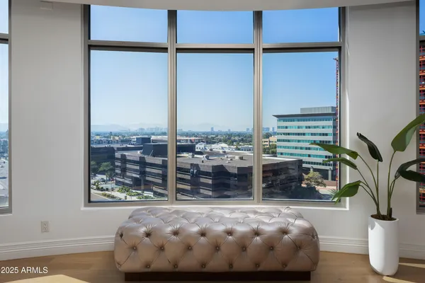 a picture of a floor to ceiling window and an outdoor view