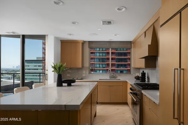 a kitchen with a sink a counter and cabinets