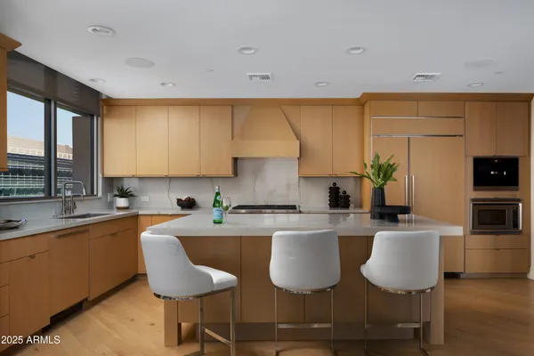 a kitchen with a sink cabinets and window