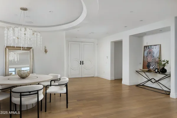 a view of a dining room with furniture and wooden floor