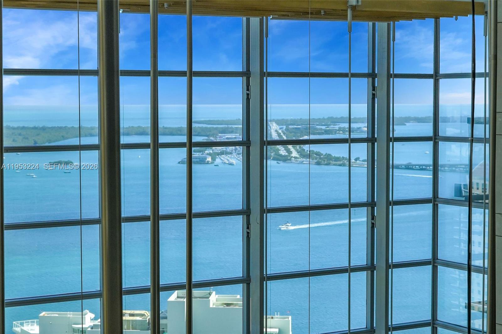 1395 Brickell Avenue, Unit 3311 Miami, FL 33131 - Photo 35 of 40 a bathroom with a glass door
