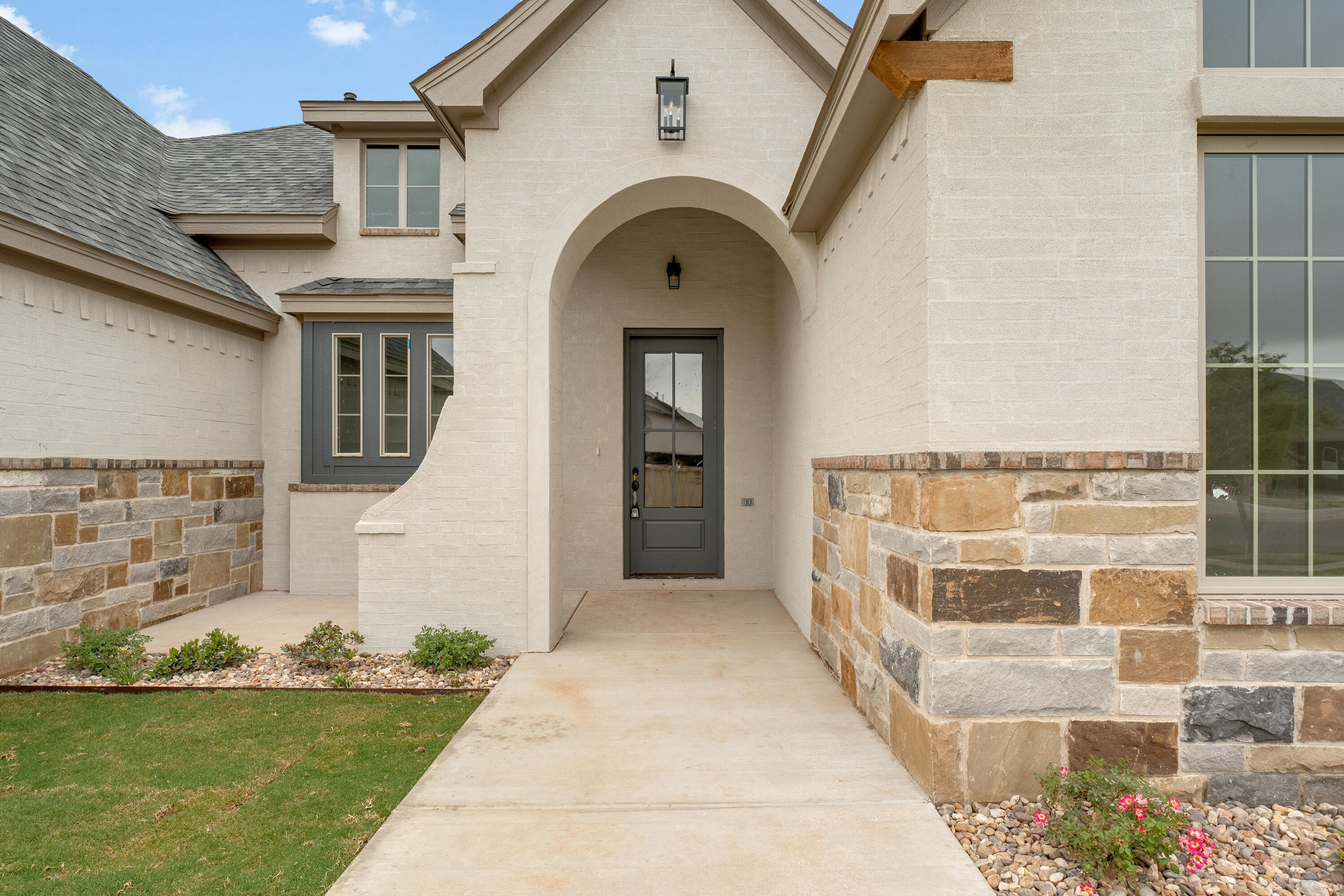 3627 119th Street Lubbock, TX 79423 - Photo 2 of 37 a front view of a house with a yard