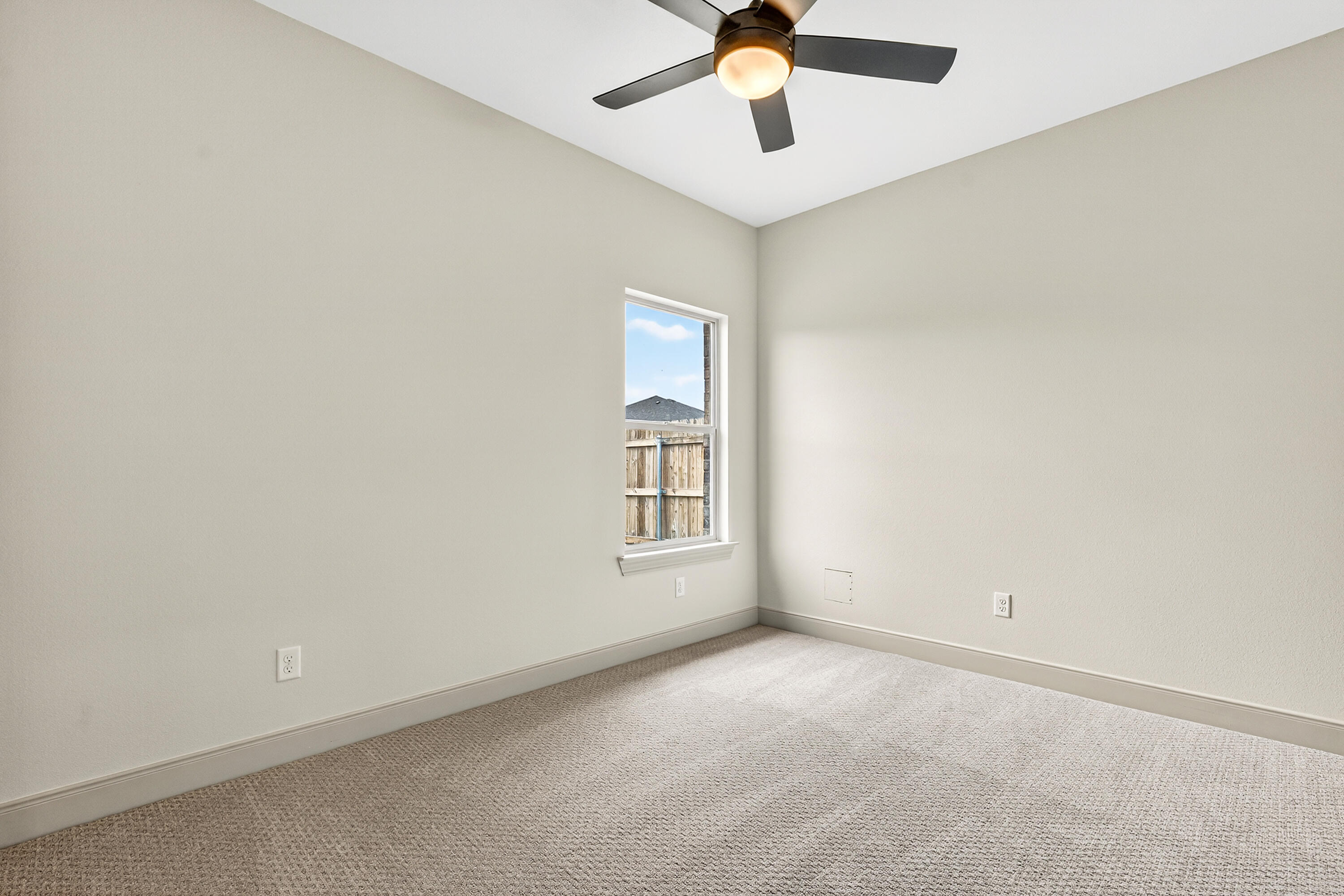 3627 119th Street Lubbock, TX 79423 - Photo 22 of 37 an empty room with a window and a fan