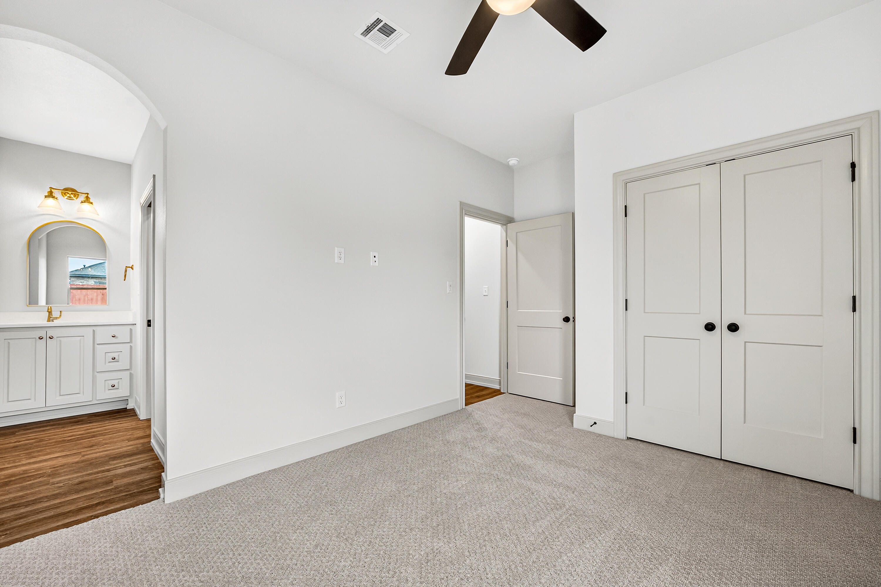 3627 119th Street Lubbock, TX 79423 - Photo 23 of 37 an empty room with chandelier fan and windows