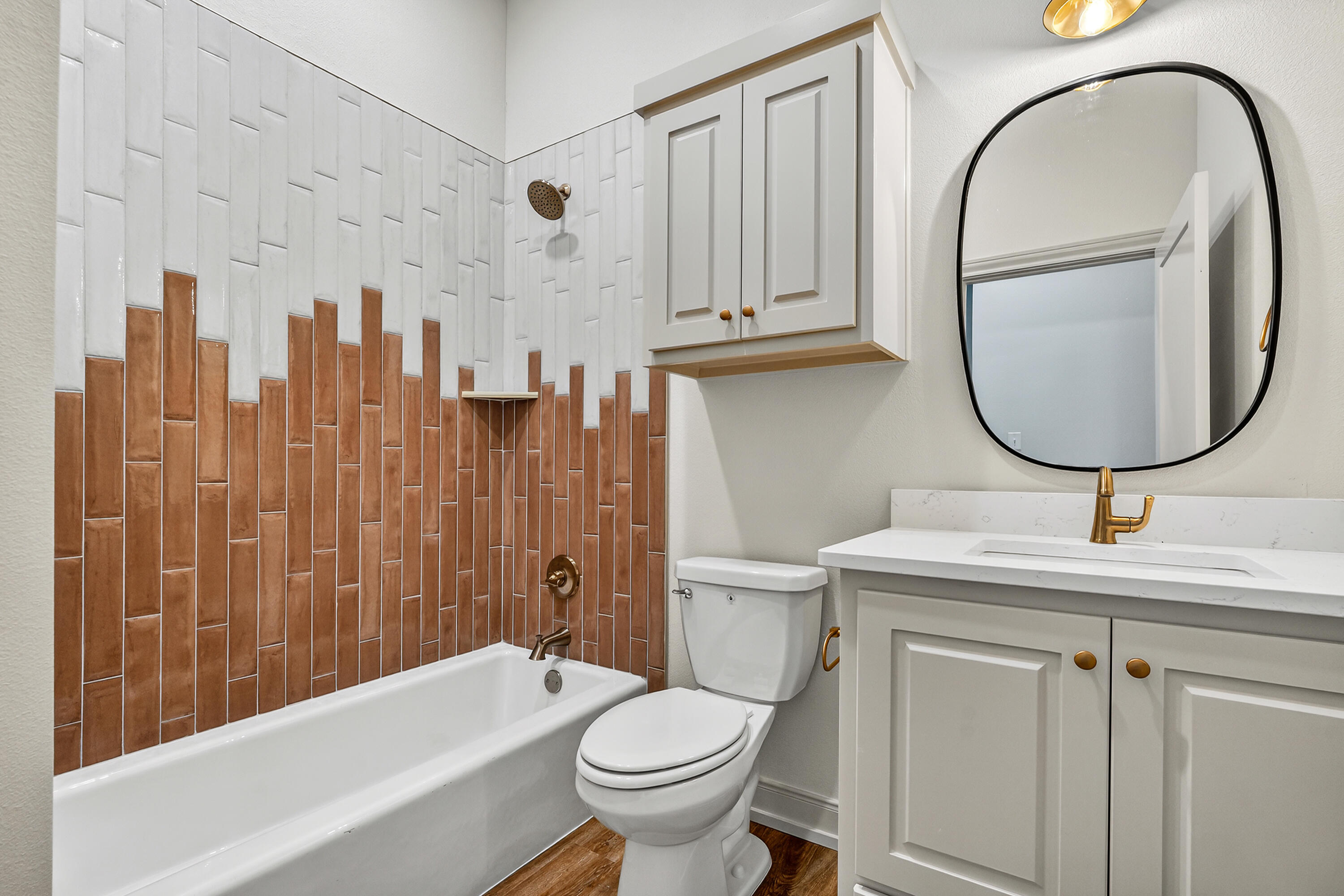3627 119th Street Lubbock, TX 79423 - Photo 28 of 37 a bathroom with a sink a toilet and a mirror