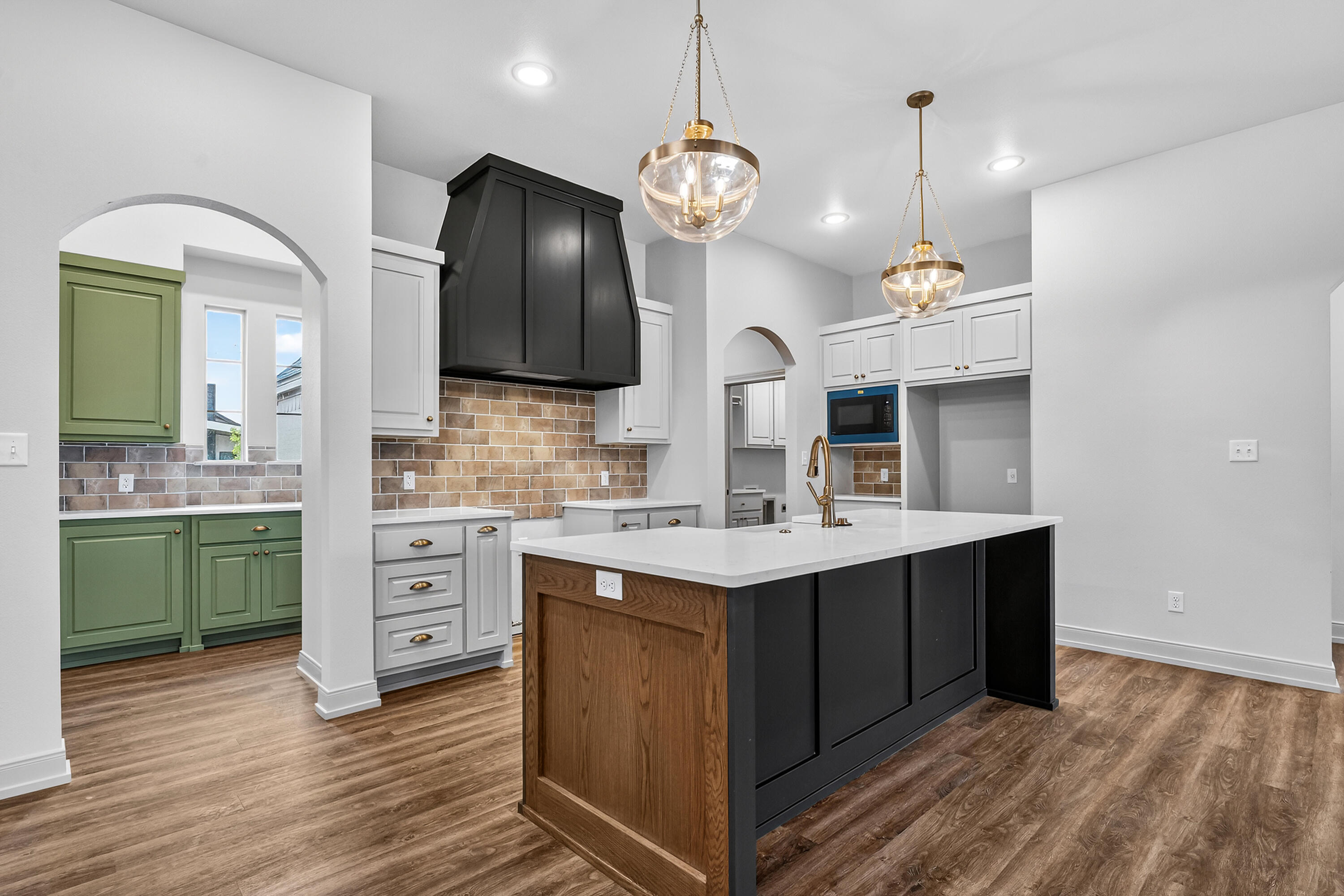 3627 119th Street Lubbock, TX 79423 - Photo 8 of 37 a kitchen with kitchen island a sink stainless steel appliances and cabinets