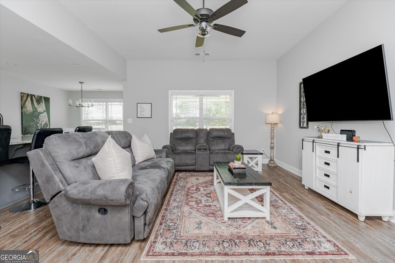 104 Meredith Layne Court Perry, GA 31069 - Photo 8 of 46 a living room with furniture and a flat screen tv